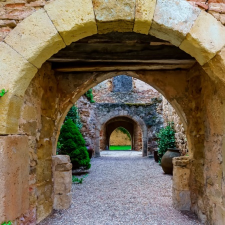 Stone archway in a medieval street in Pedraza, Segovia, Castilla y León