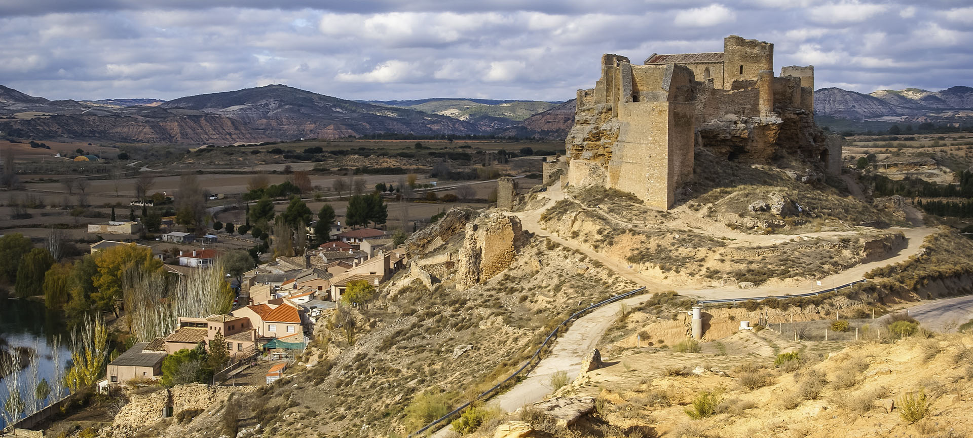 "Zorita de los Canes Castle (Guadalajara, Castilla-La Mancha) dominates the view of the town " "Zorita de los Canes Castle (Guadalajara, Castilla-La Mancha) dominates the view of the town "