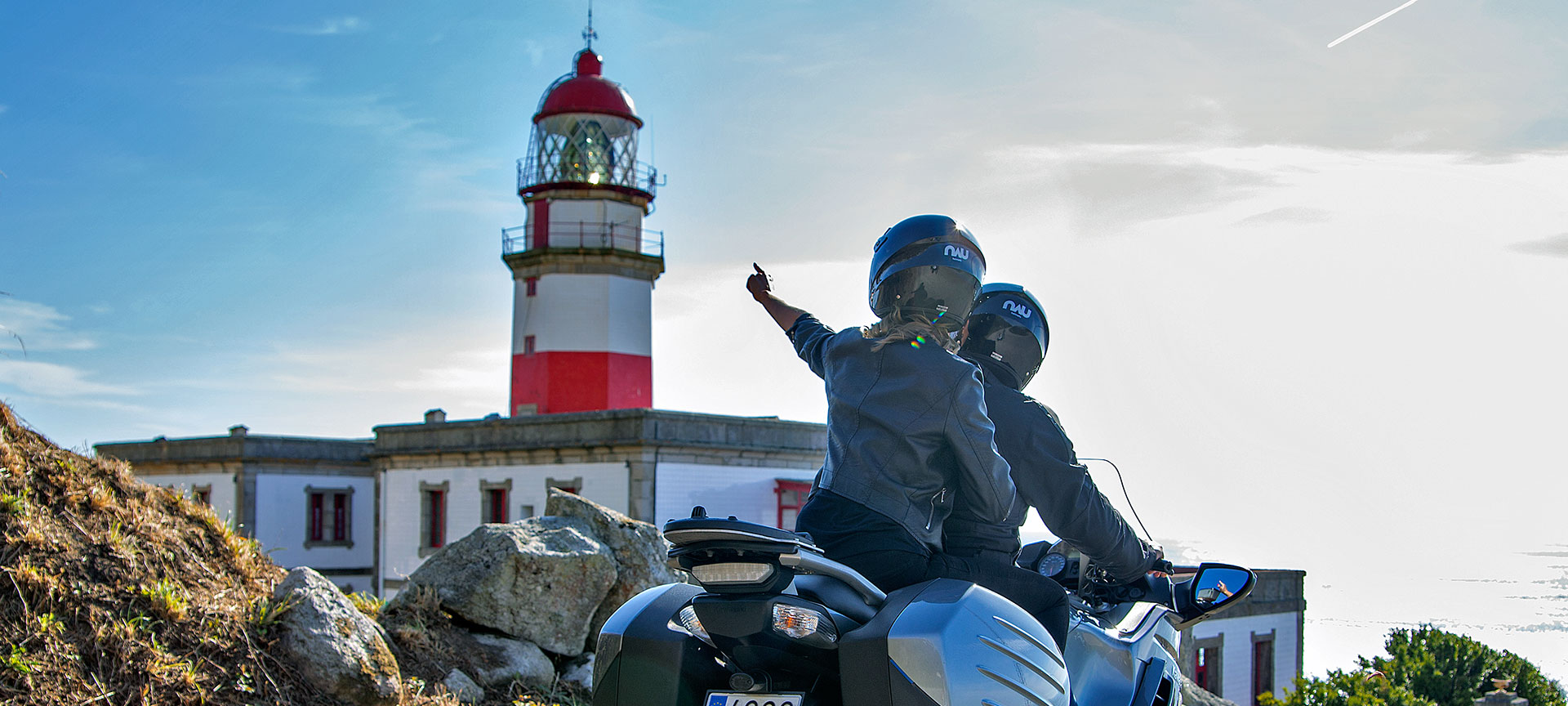 Tourists on motorbikes on the Galicia lighthouses route Tourists on motorbikes on the Galicia lighthouses route