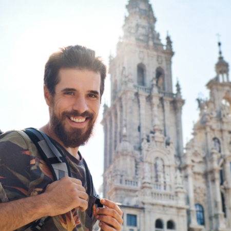 Pilgrim before the cathedral of Santiago de Compostela