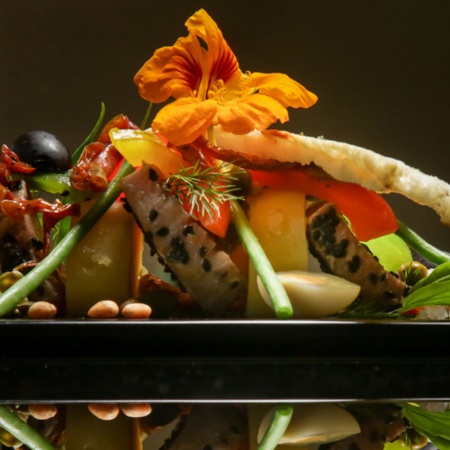 Black sesame tuna with potato, vegetables and tomato confit