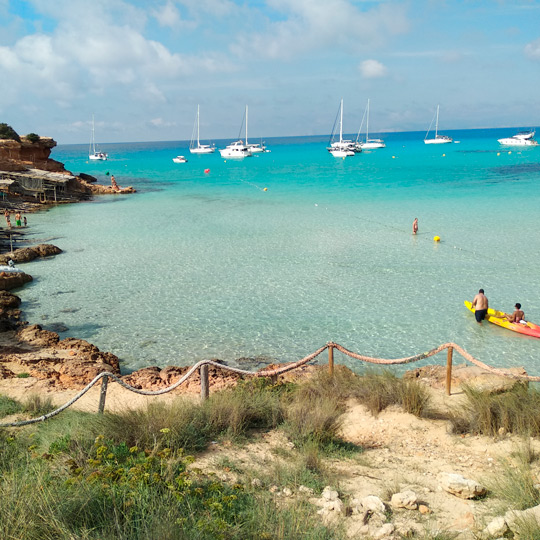 The rocks where small old boats can be found in Cala Saona, Formentera 