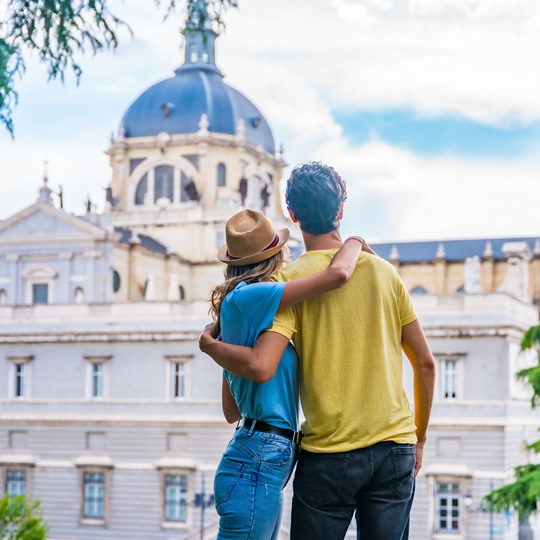 Couple in front of Almudena Cathedral, in Madrid Couple in front of Almudena Cathedral, in Madrid