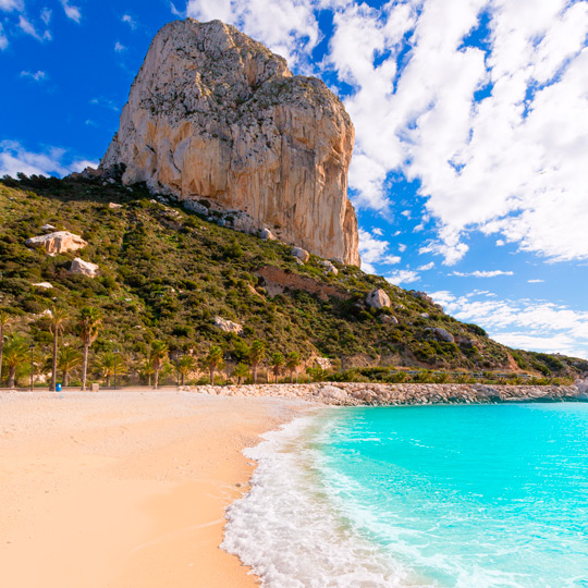 Cala El Racó and the imposing Ifach cliff in Calpe, Alicante