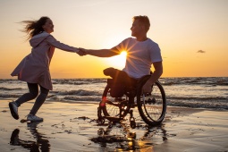 Tourists enjoying the beach with full wheelchair accessibility